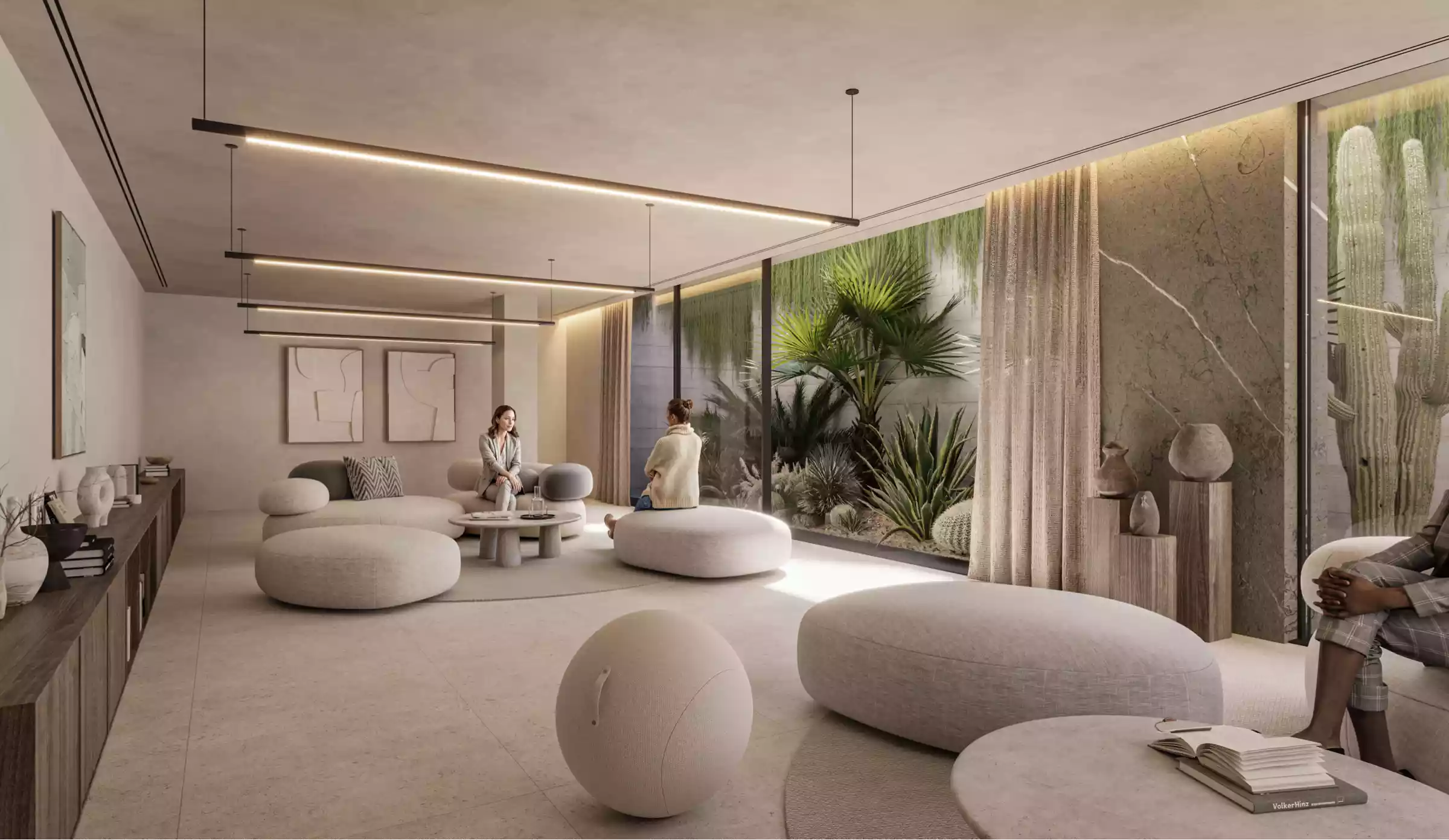 Salón interior en Naghoi con luz natural y diseño minimalista, creado para la conversación tranquila y la recuperación.