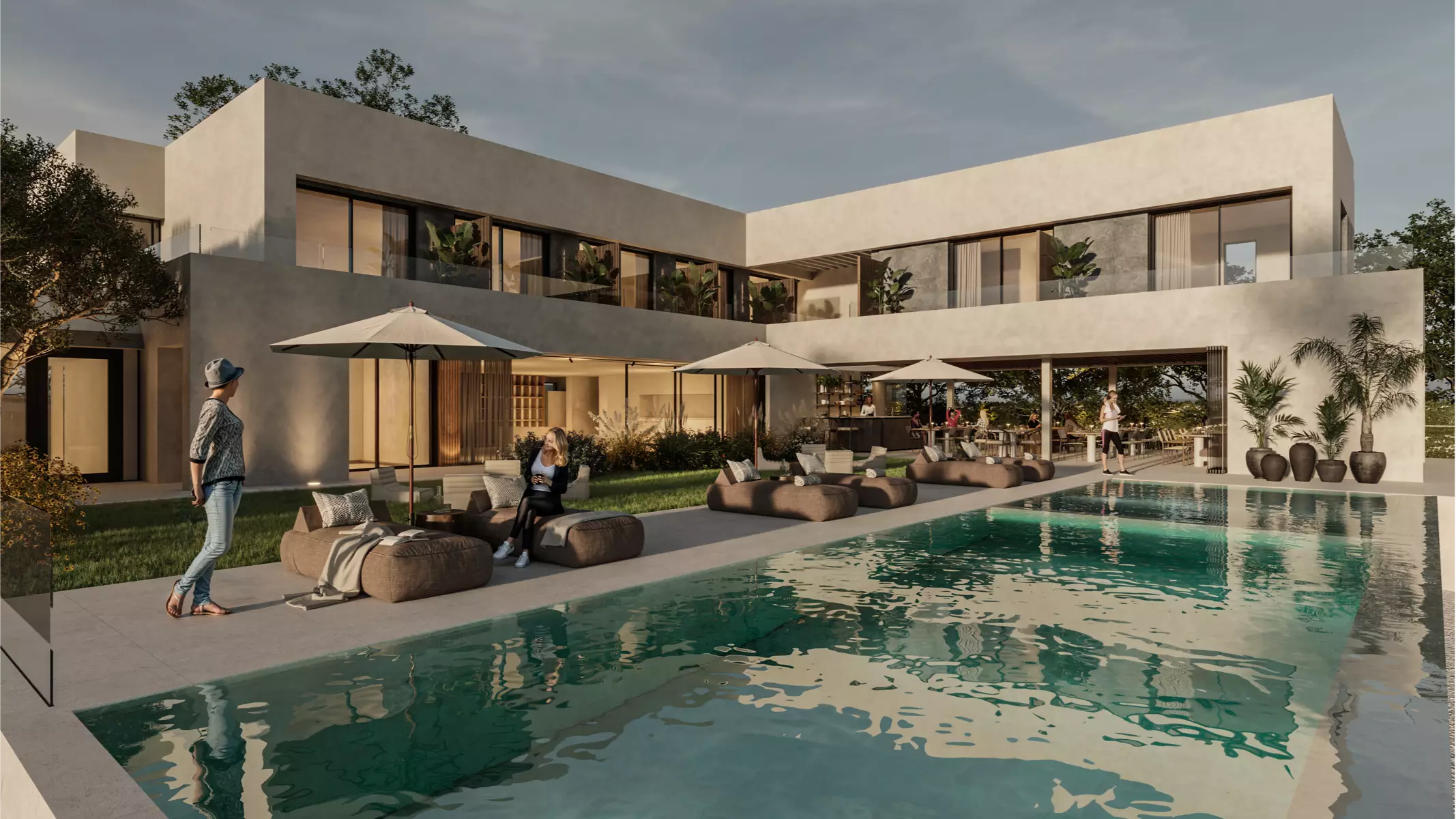 Moderna zona de piscina al aire libre en Naghoi con tumbonas, sombrillas y espacio de comedor al aire libre para la relajación del paciente y la conexión social.